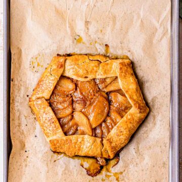 baked apple galette on parchment paper.