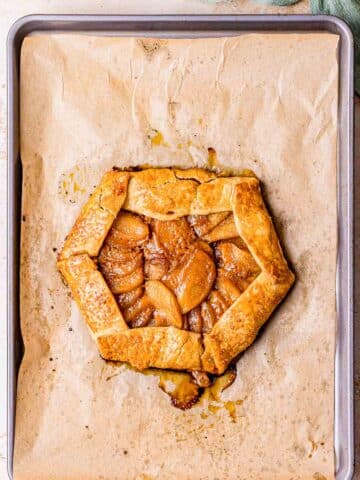 baked apple galette on parchment paper.