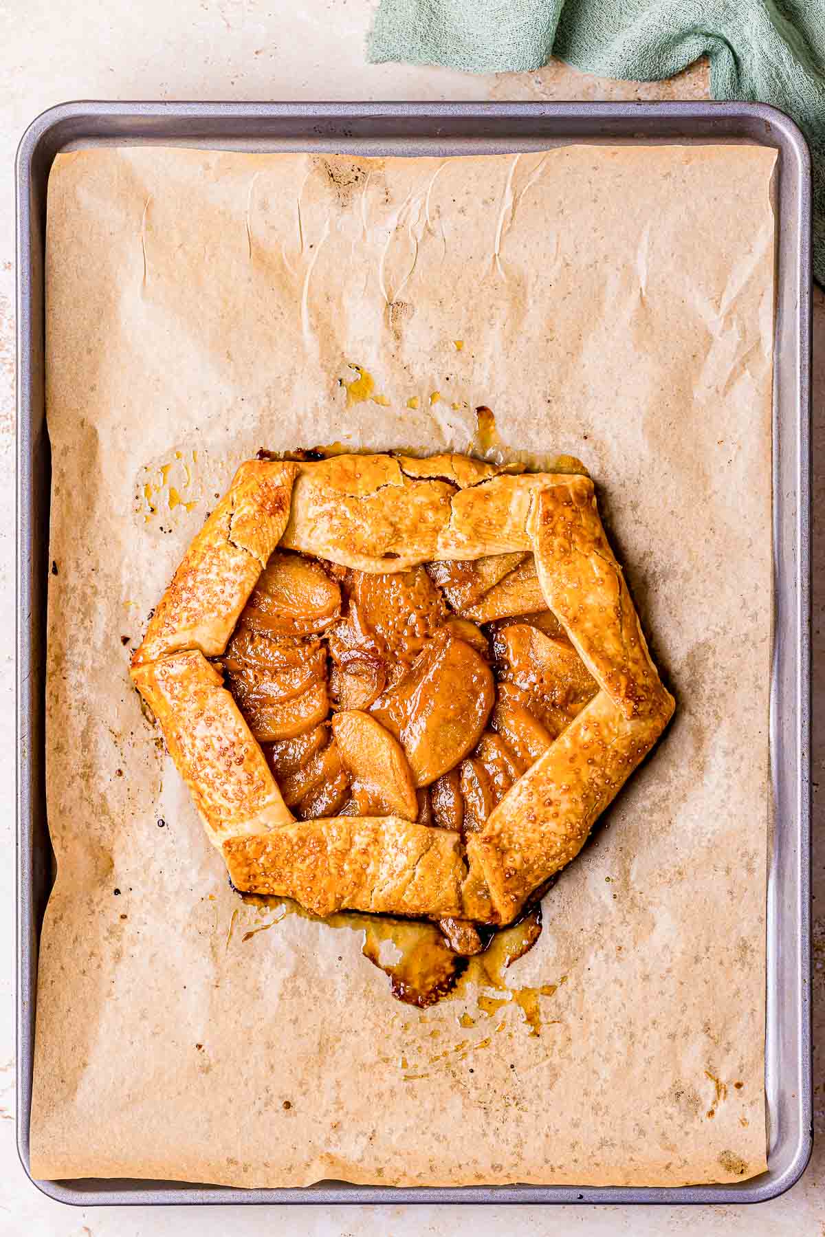 baked apple galette on parchment paper.