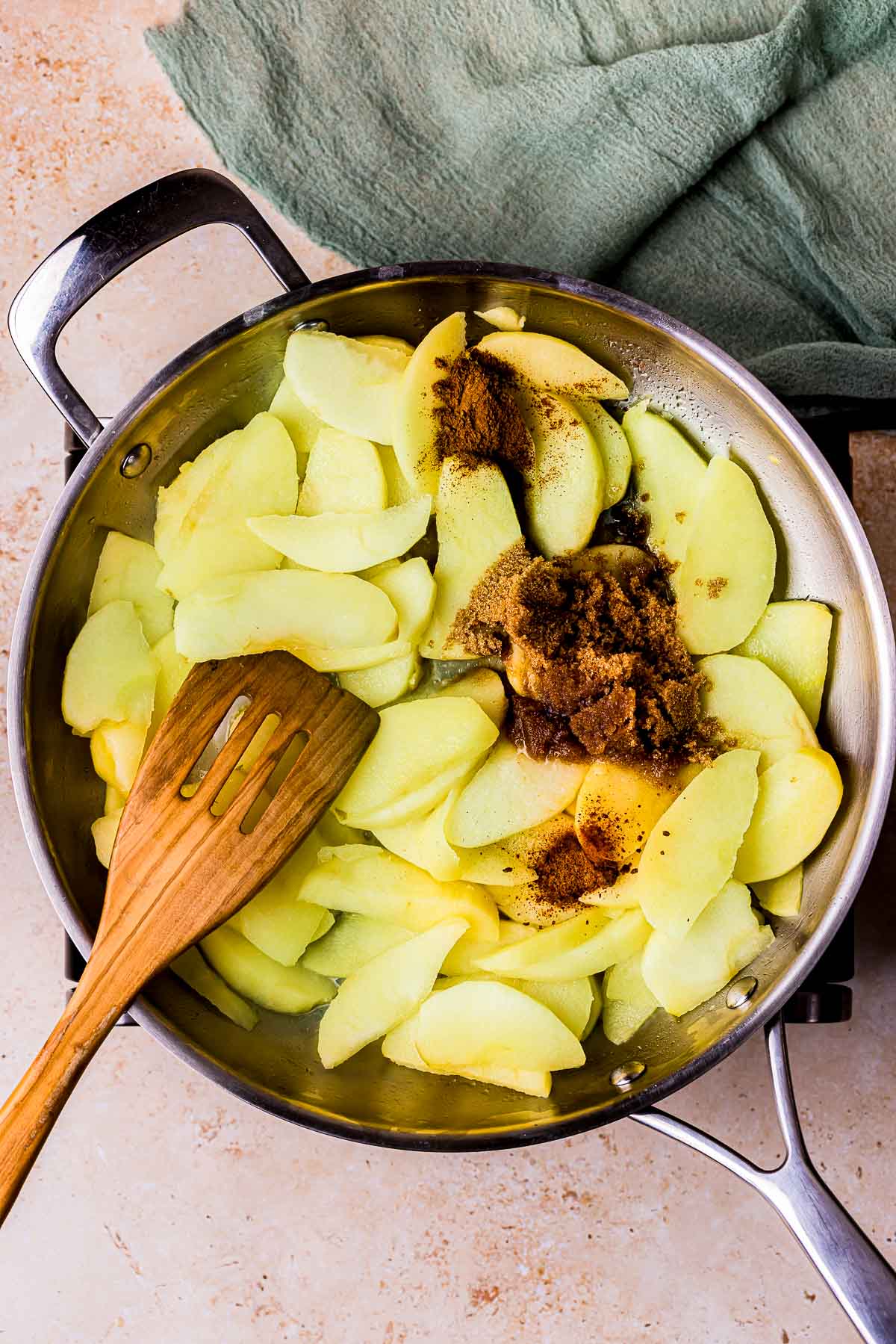 apples and spices cooking in a skillet.