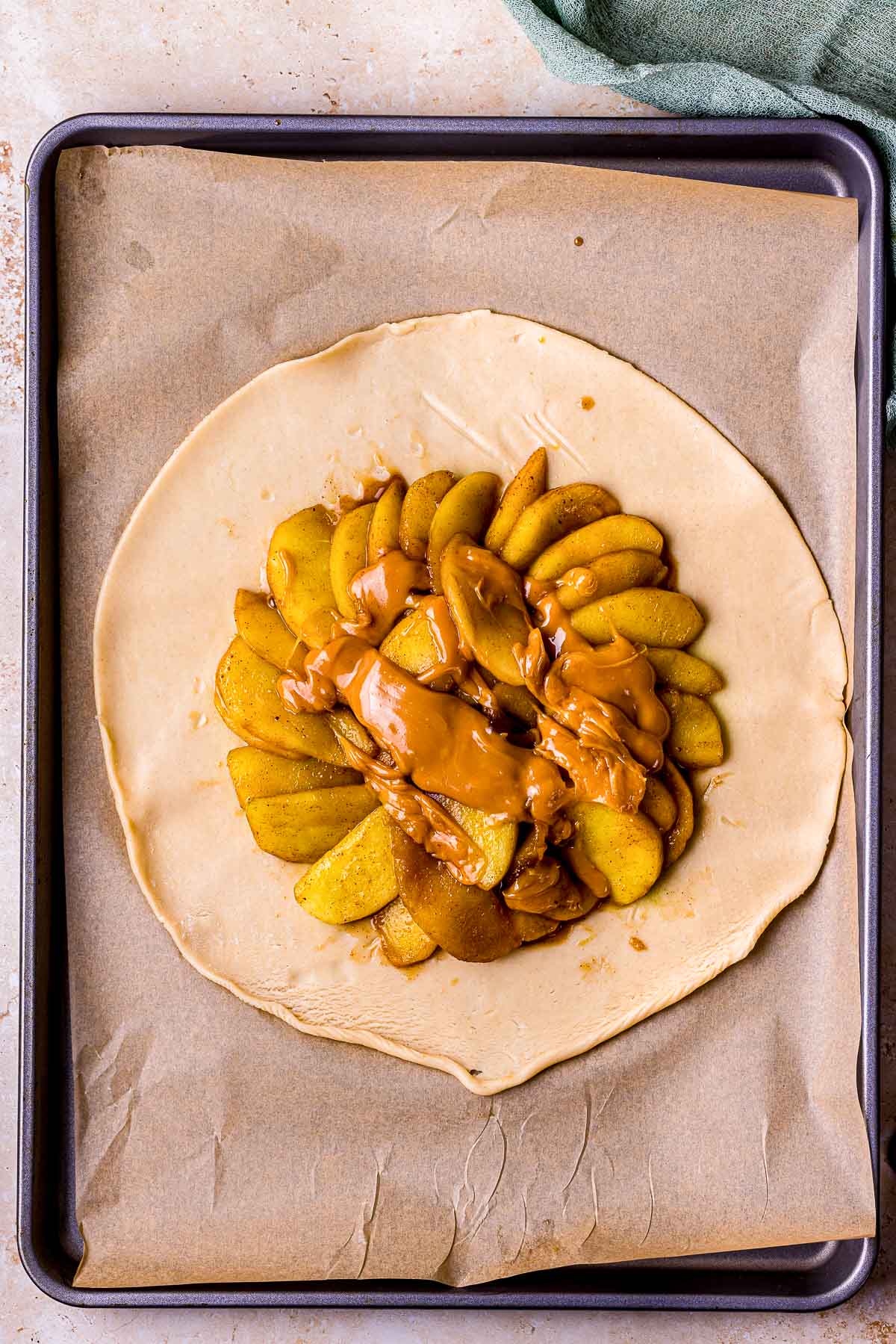 apples in the center on a flat pie crust.