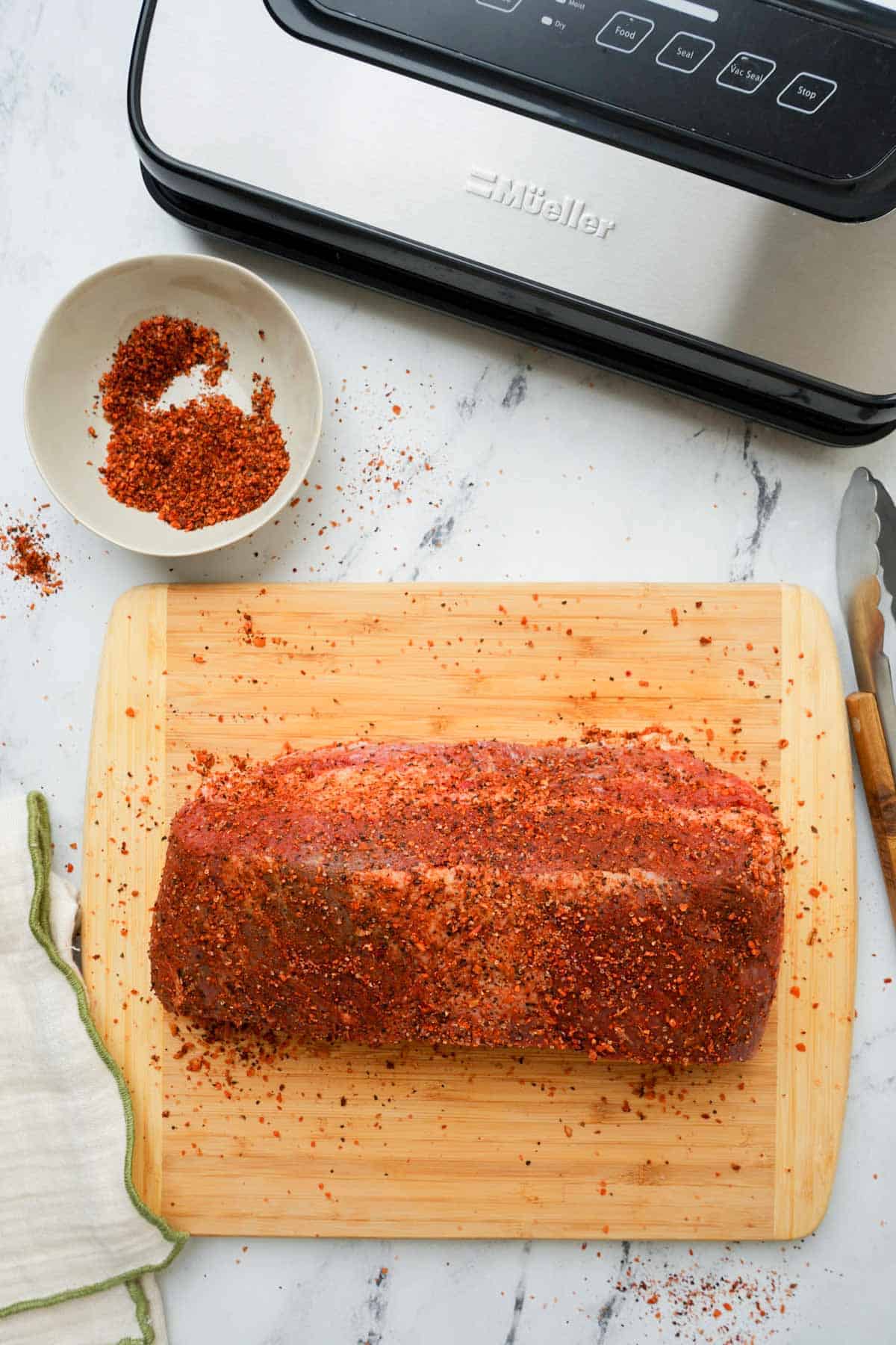 seasoned beef on a cutting board.