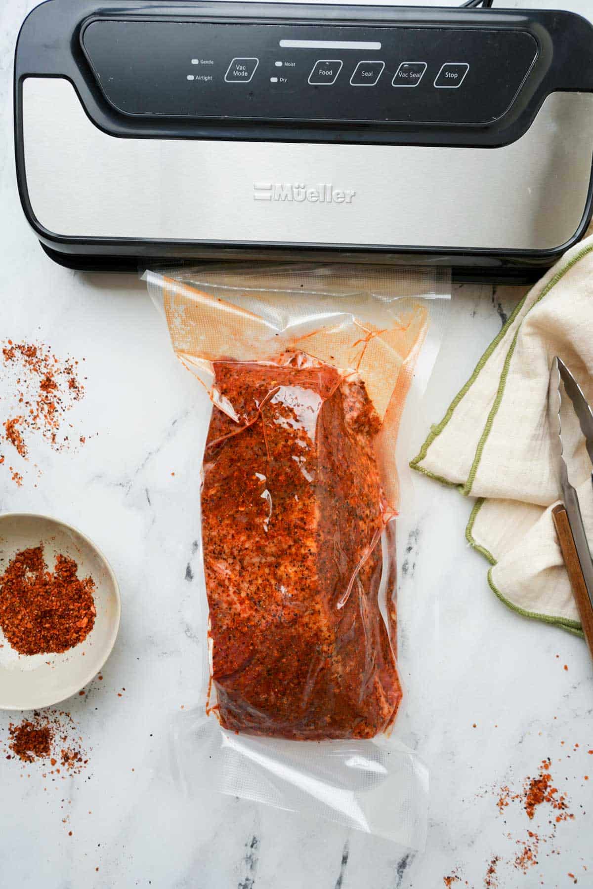 beef being vacuum sealed in a bag.