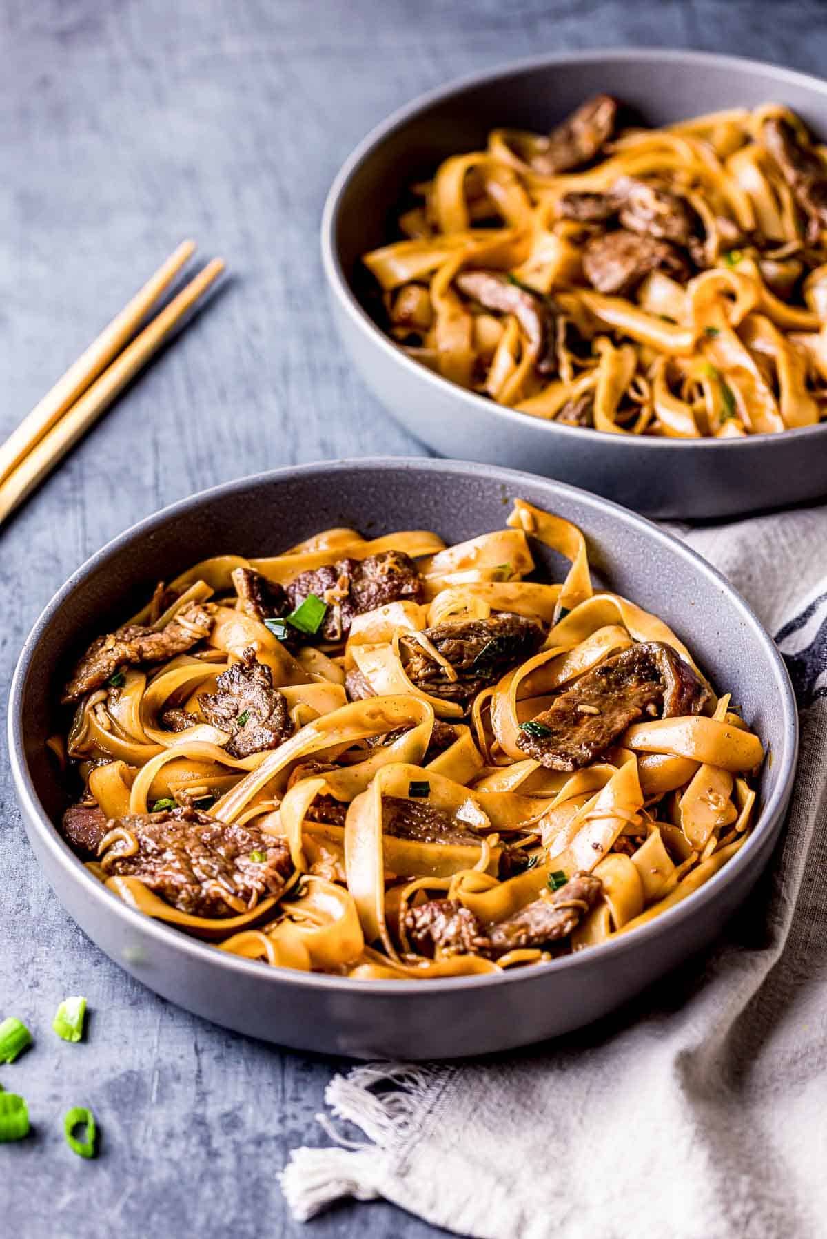 2 bowls of beef chow fun noodles.