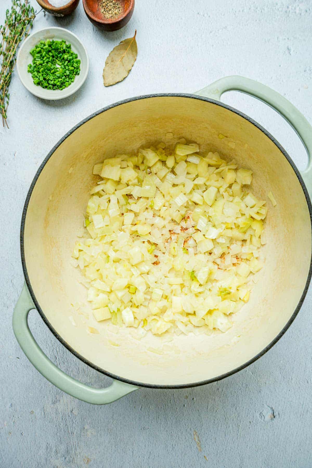 onions and garlic coking in a pot.