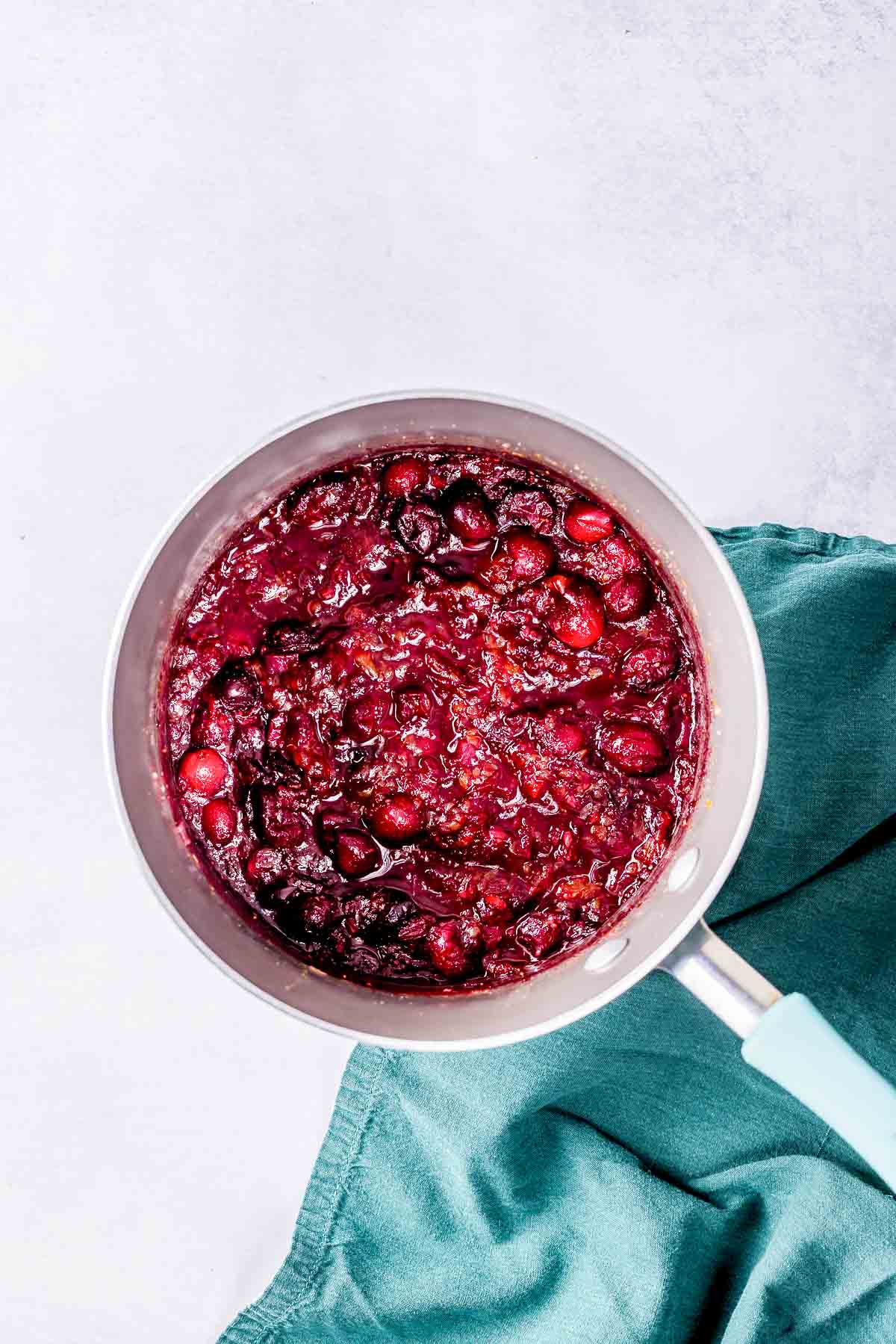 cranberry sauce cooked down in a saucepan.