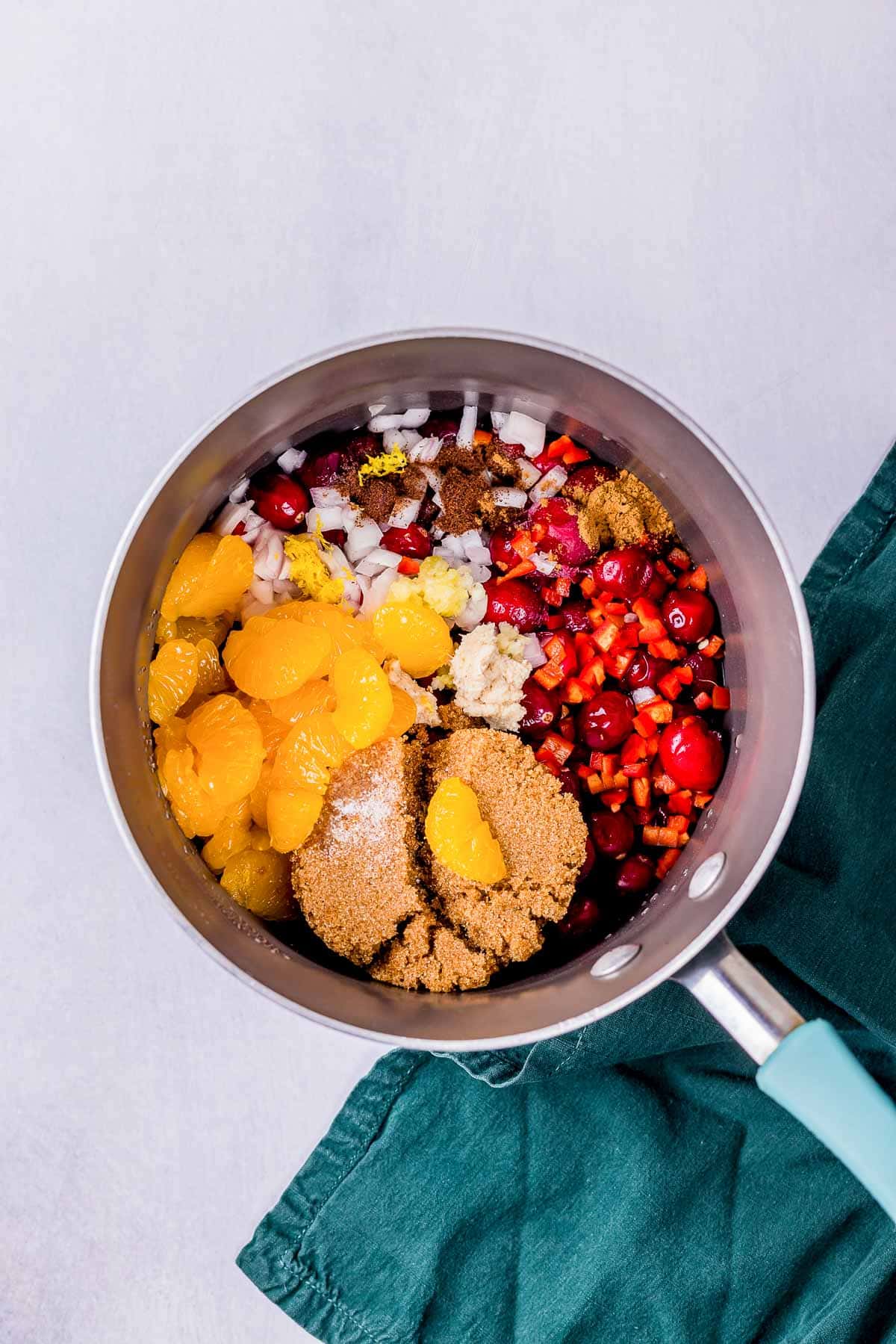 ingredients for cranberry chutney in a saucepan.