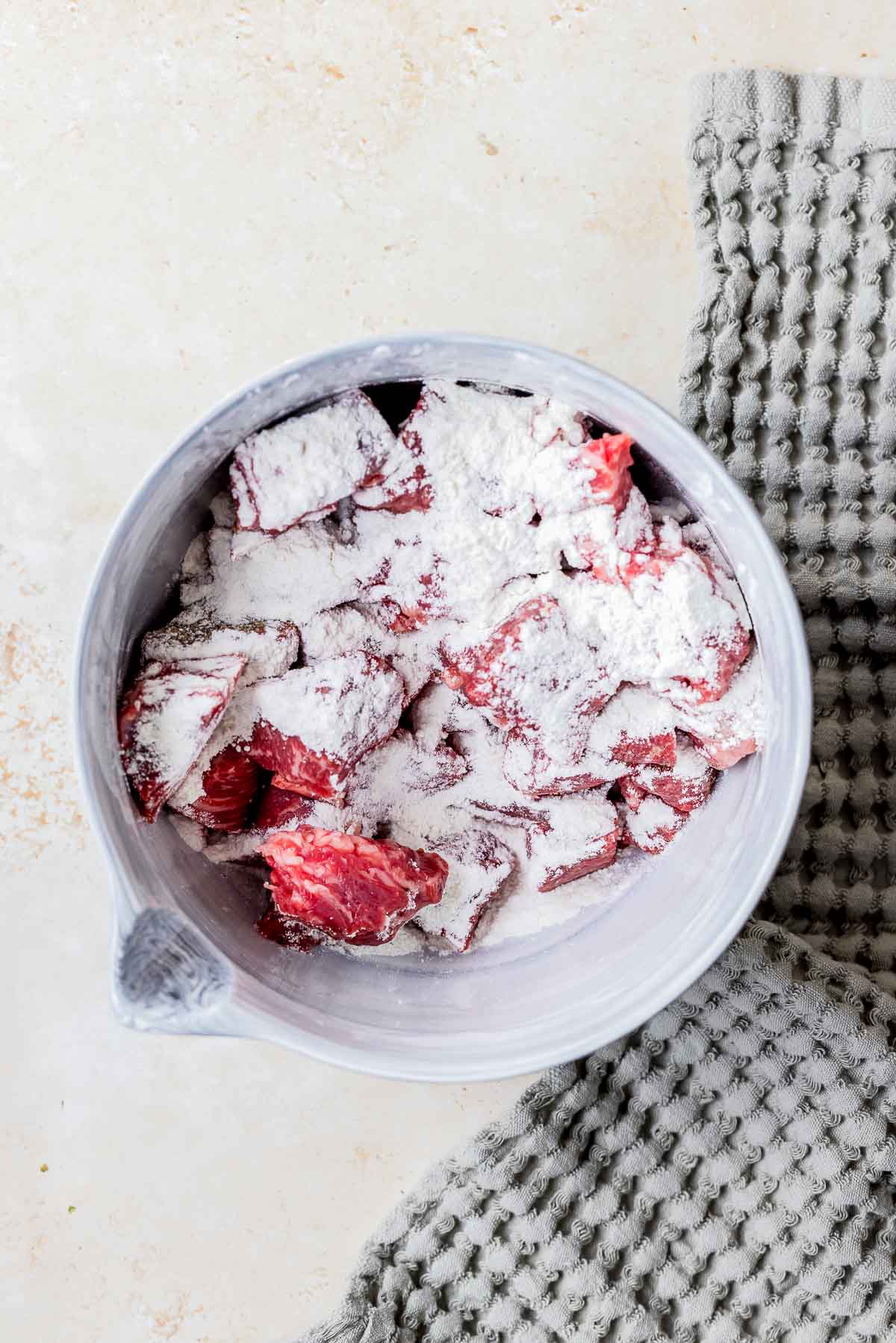 beef cubes coated in flour.