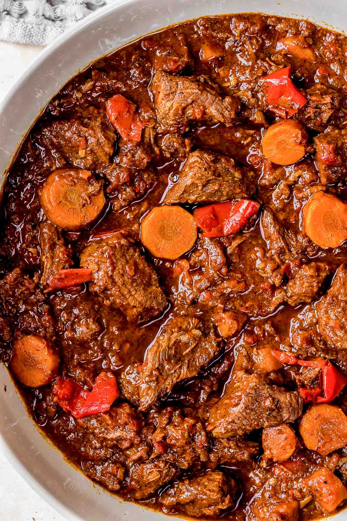 beef goulash with carrots in a pot.