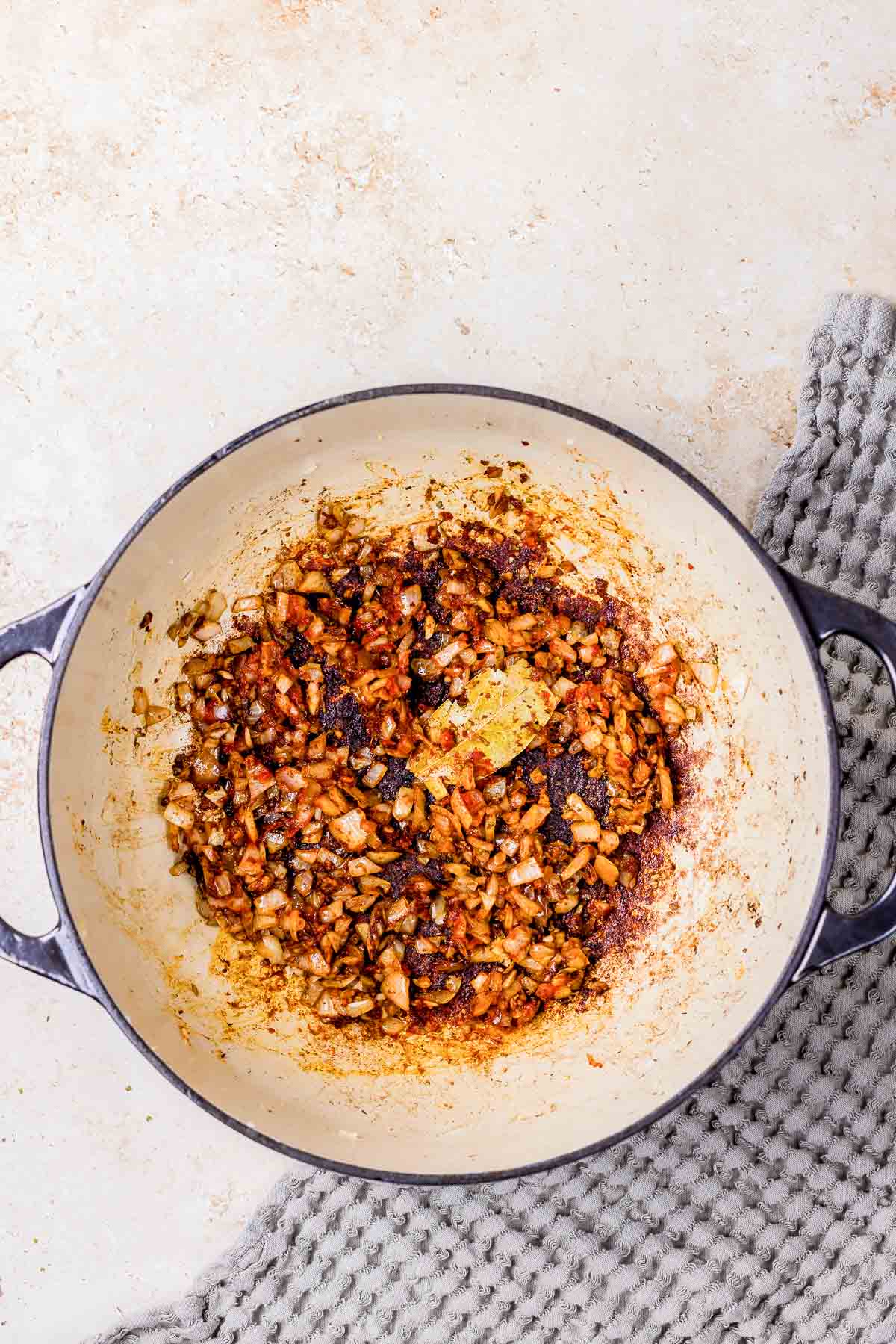 cooked down onions in a pot.