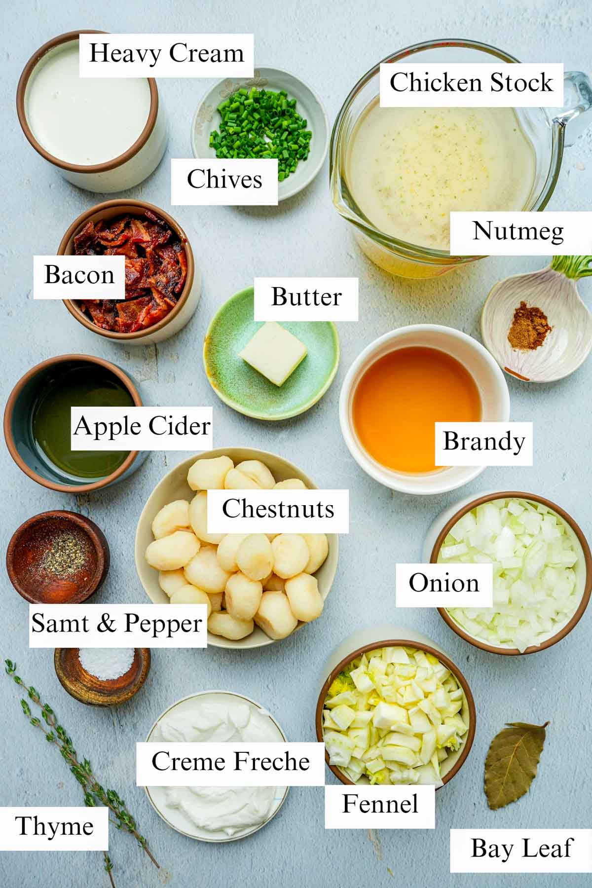 ingredients for chestnut soup on a grey board.