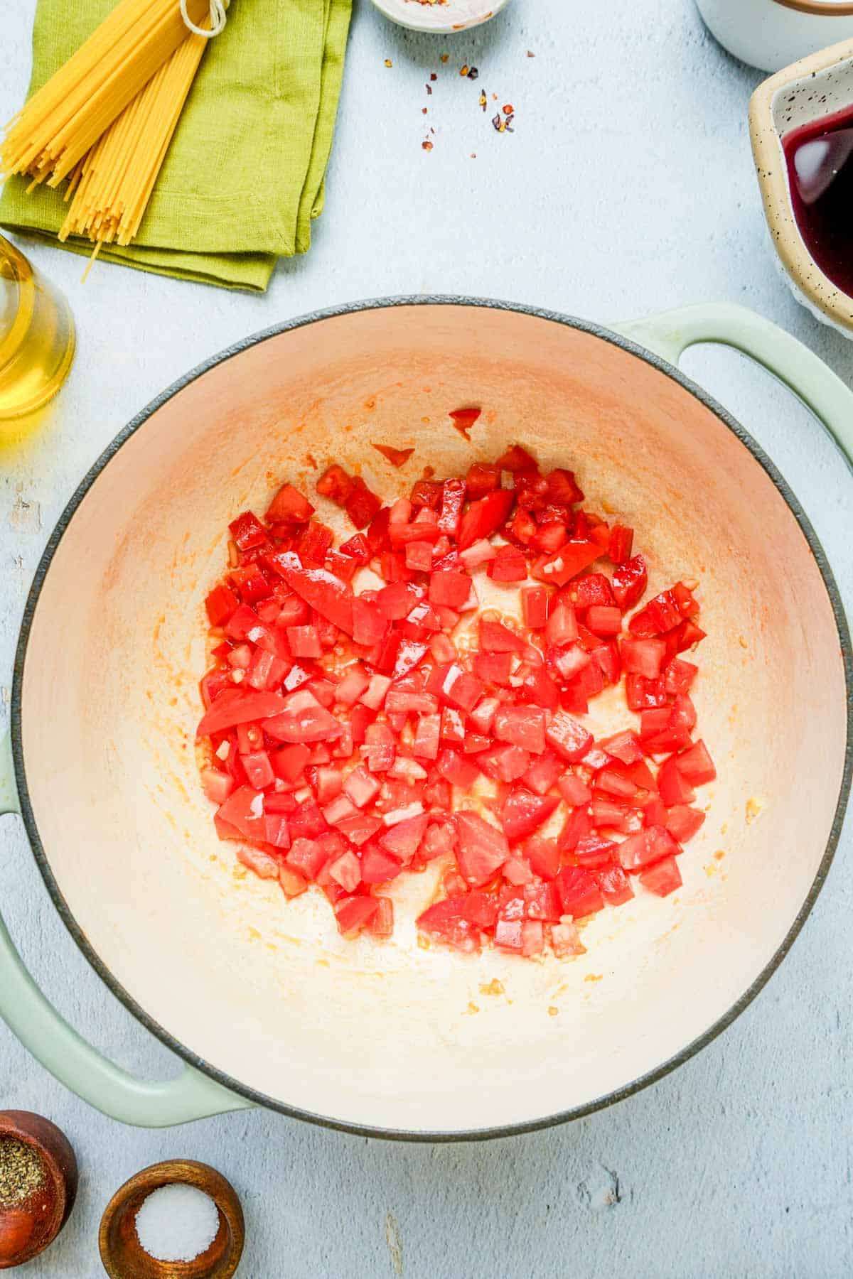 red peppers coking in a skillet.