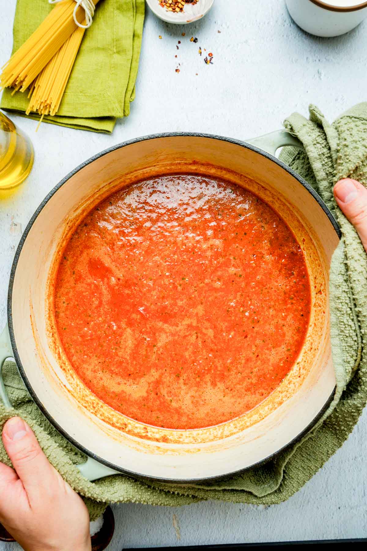 creamy red pepper sauce cooking in a pot.