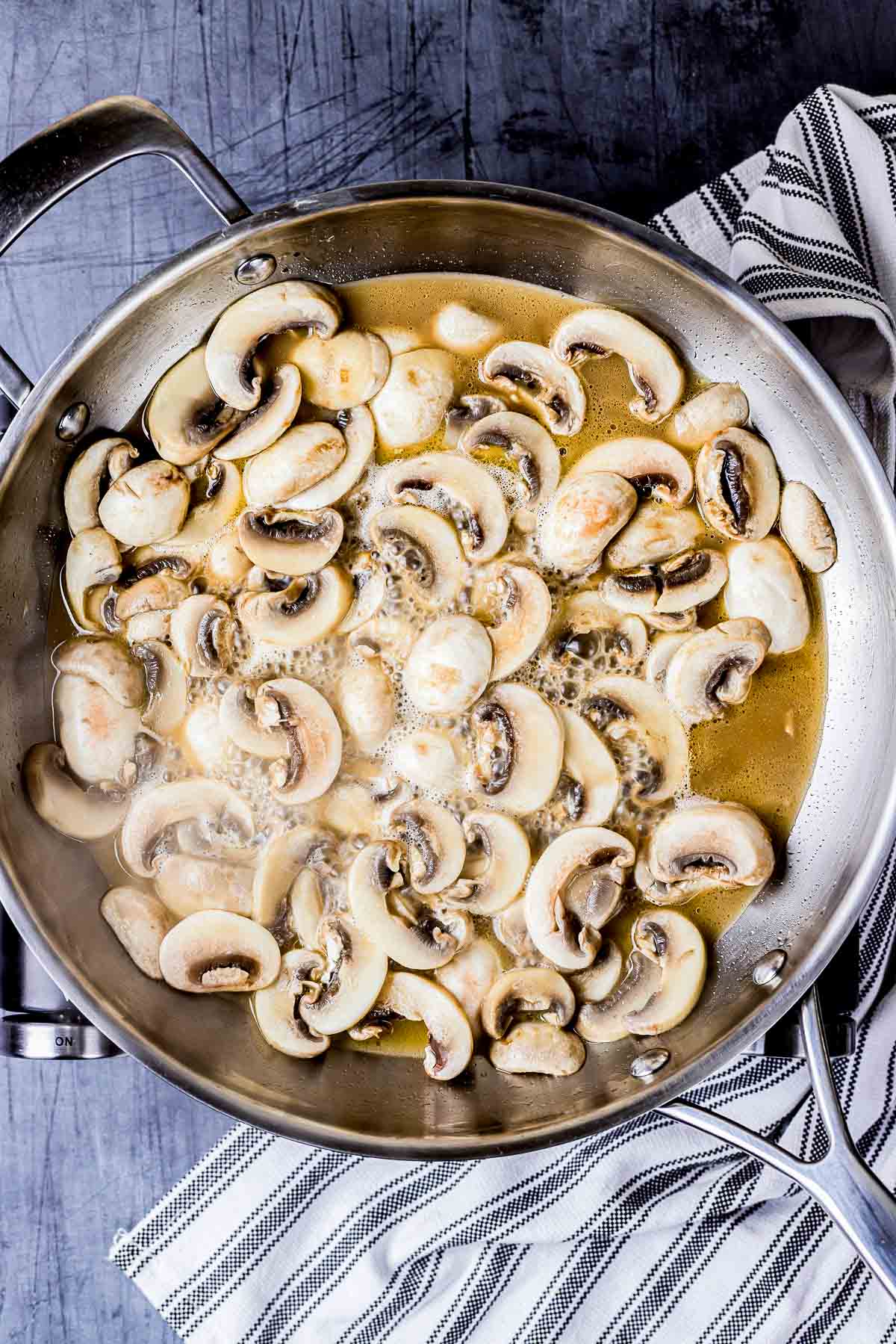 mushrooms and liquid in a skillet.