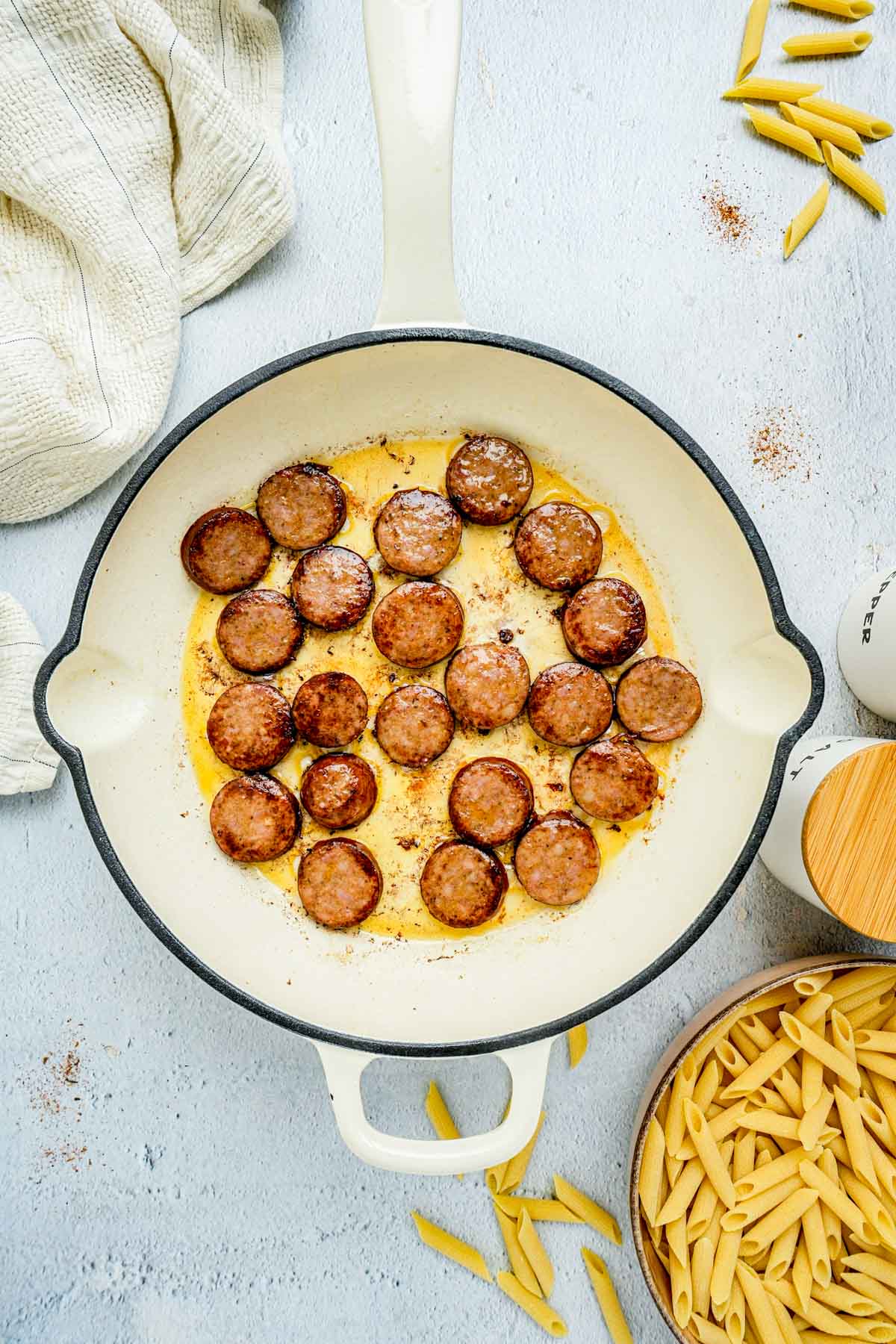 sausage cooking in a skillet.