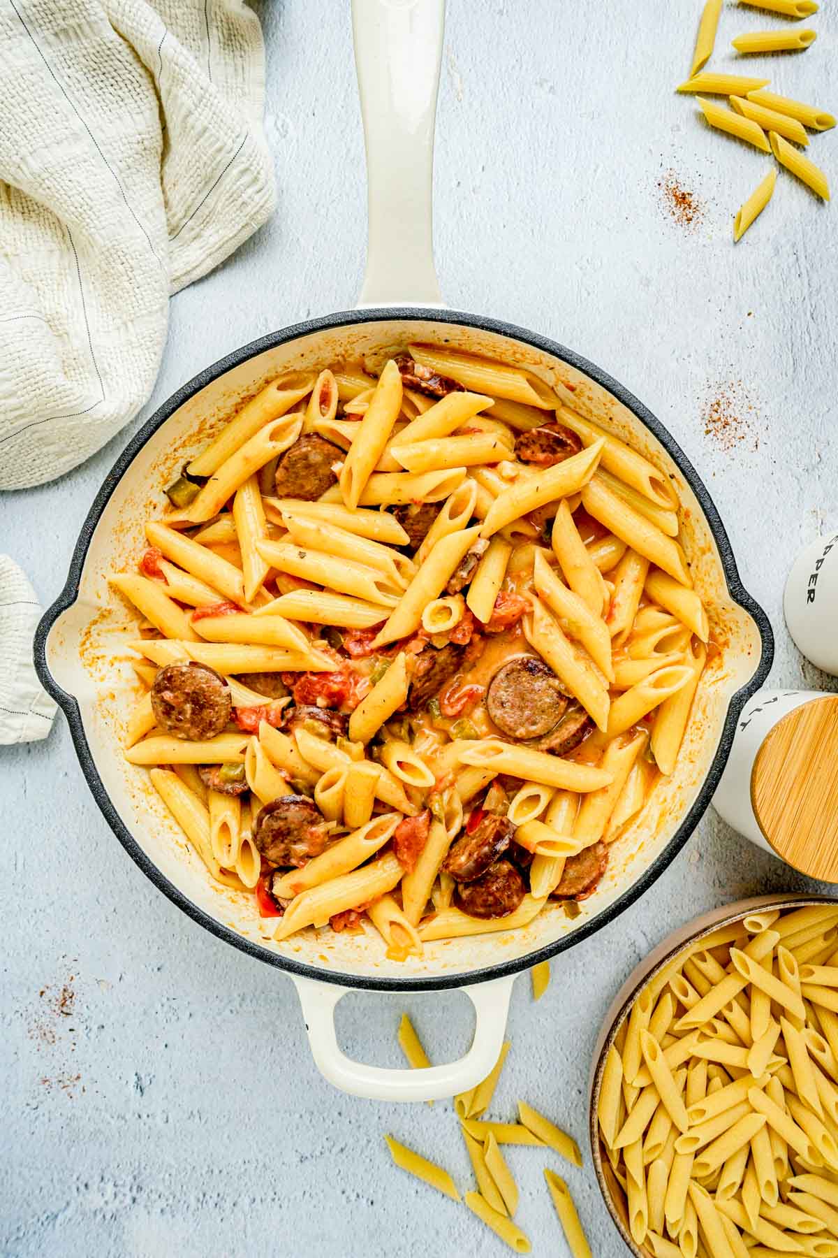 pasta in a creamy sauce in a pan.