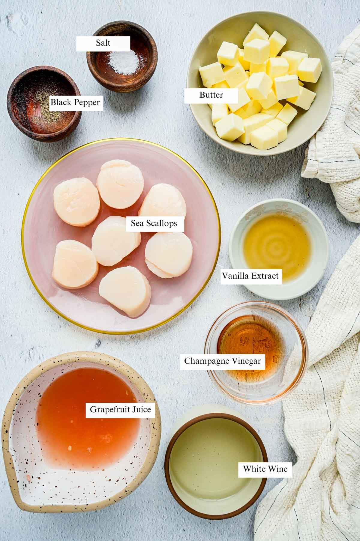 ingredients for air fryer scallops on a board with text overlay.