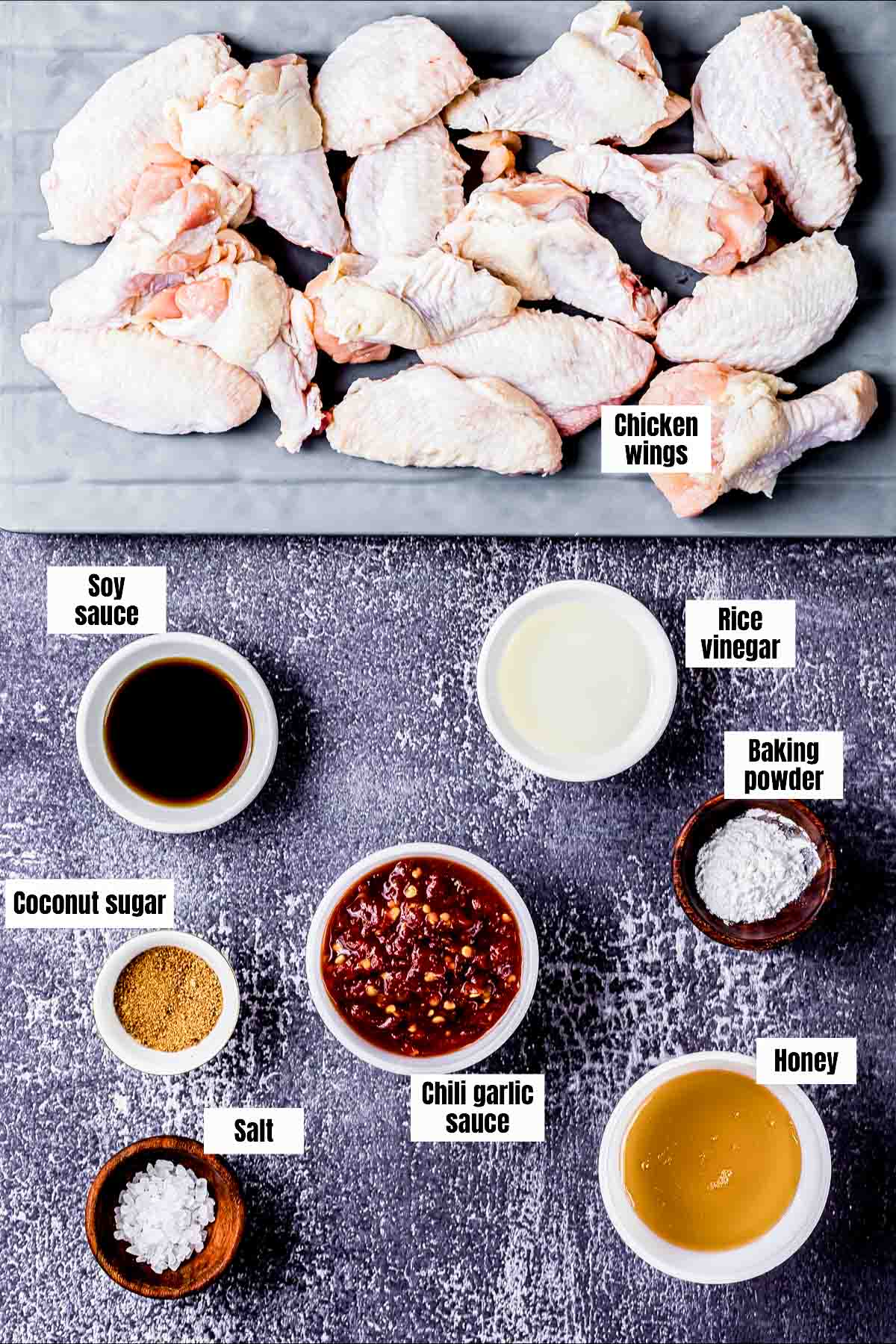 ingredients for garlic soy wings on a board.