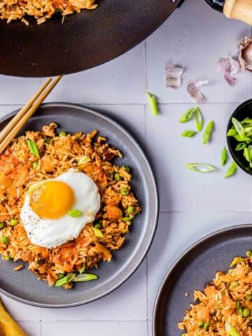 kimchi bacon fried rice topped with a fried egg.