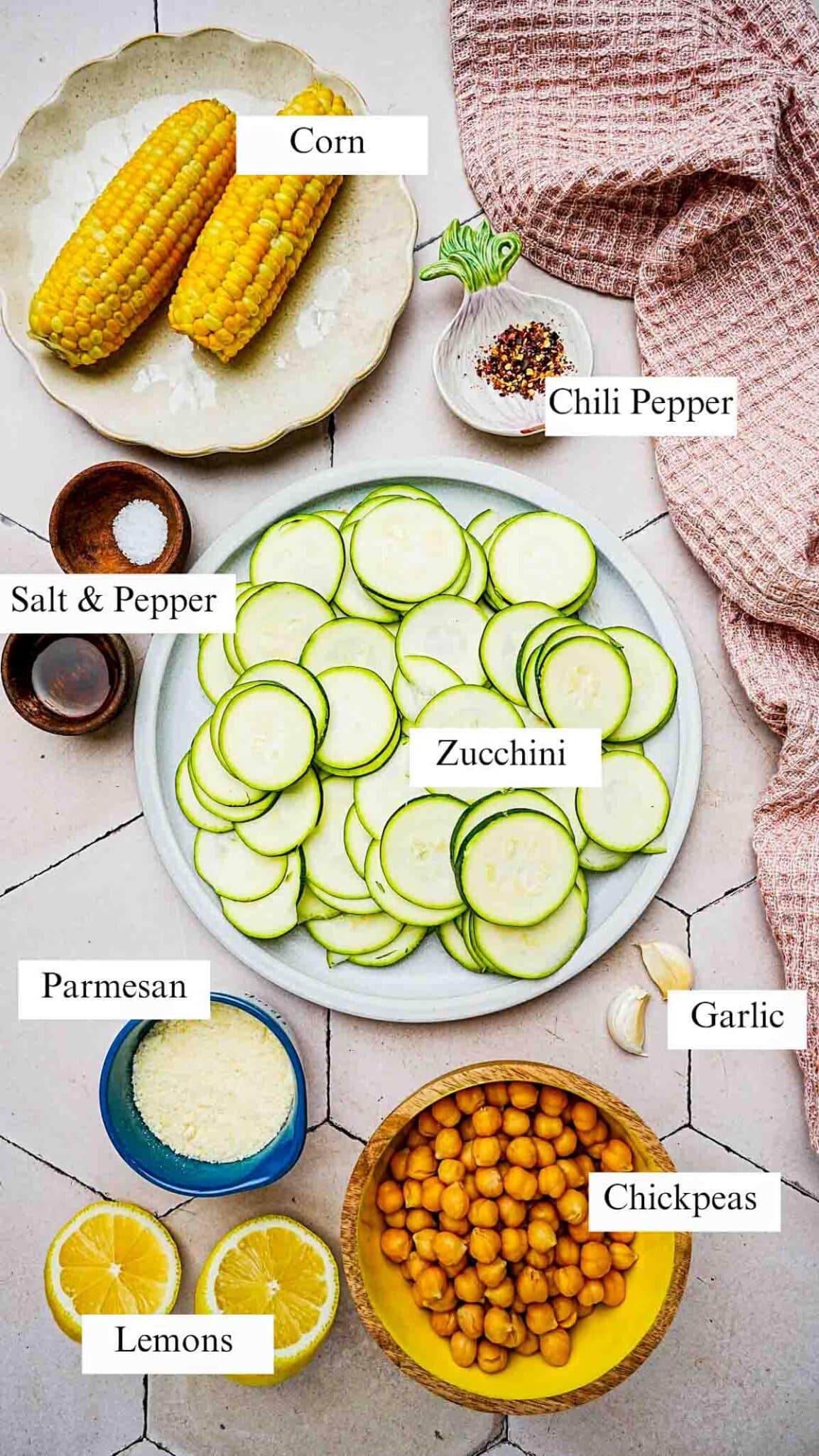 ingredients for raw zucchini salad on a board.