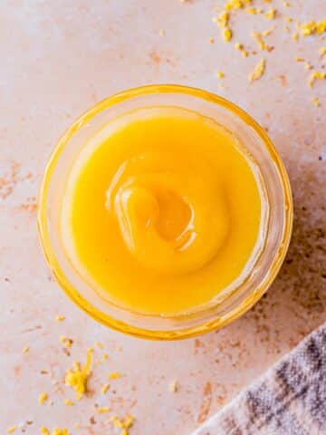 meyer lemon curd in a glass bowl.