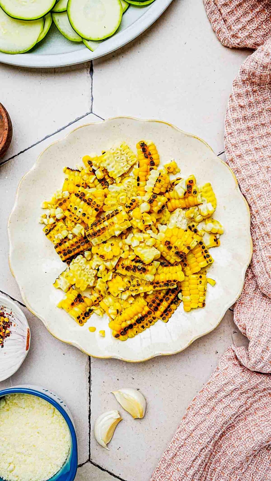 roasted corn cut off the cob on a plate.