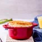 a souffle in a red ramekin.