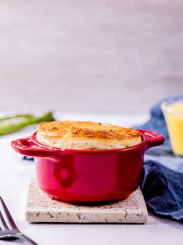 a souffle in a red ramekin.