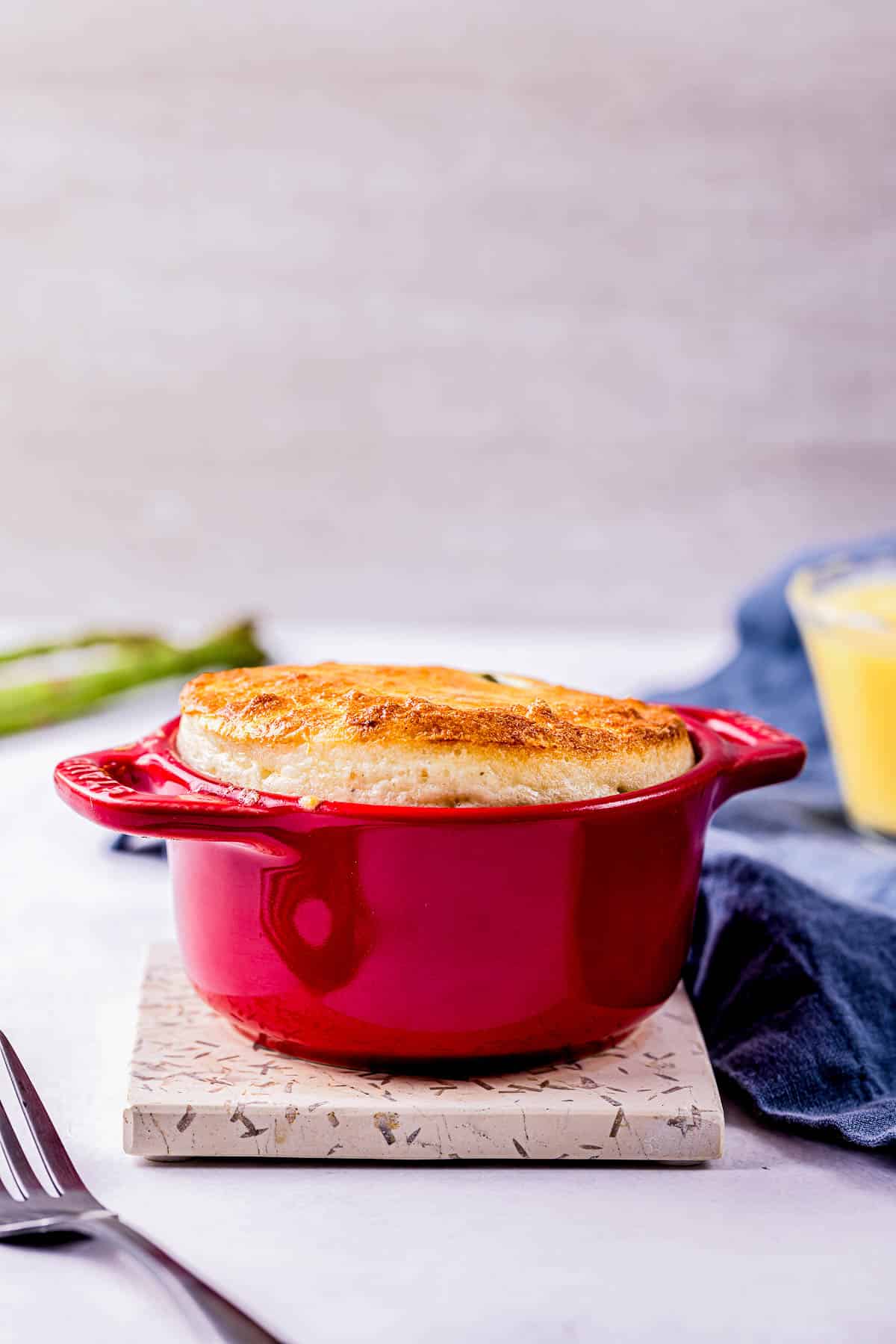 a souffle in a red ramekin.