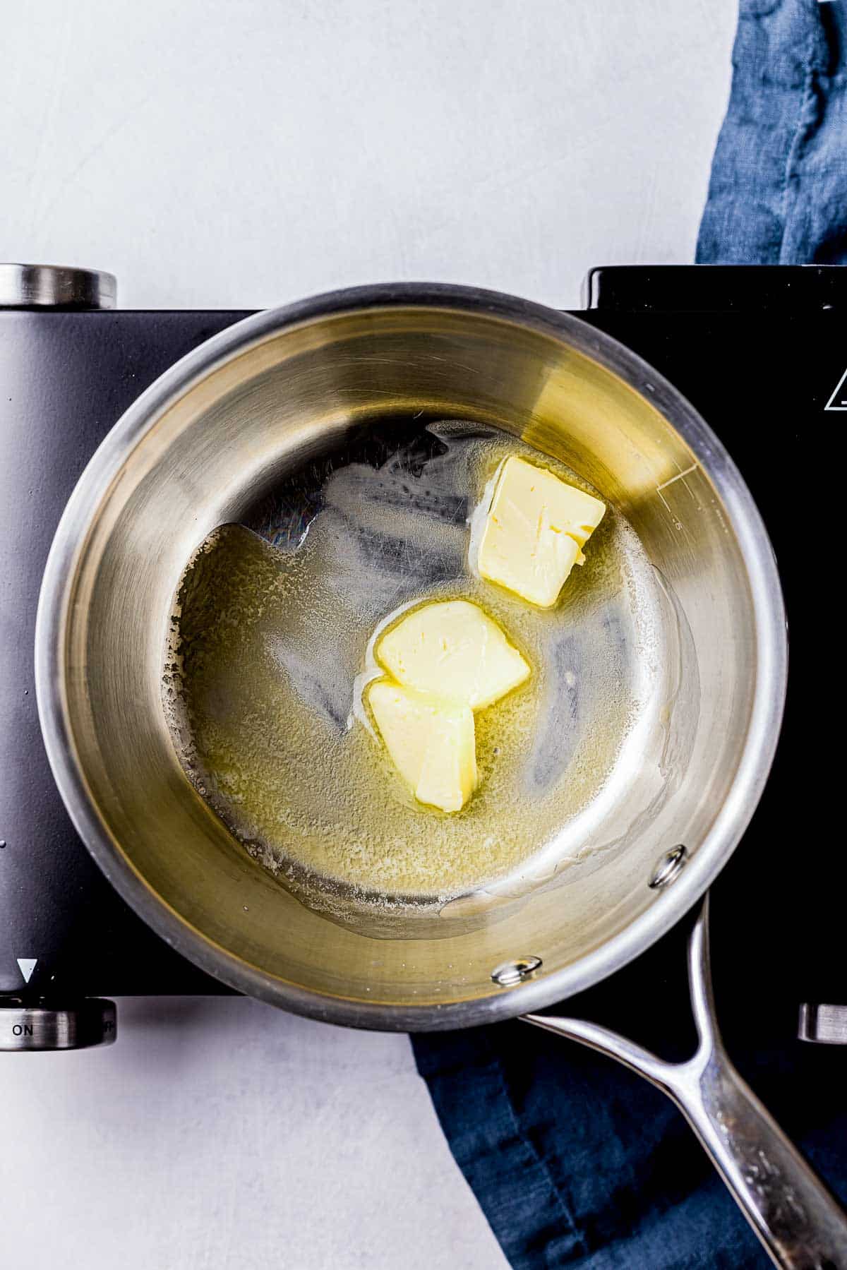 butter melting in a saucepan.